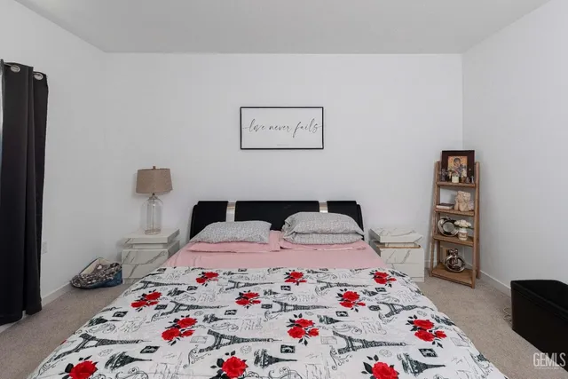 a bedroom with a bed and a couch