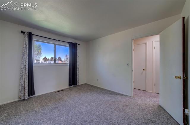 3870 Half Turn Road Colorado Springs, CO 80917 - Photo 20 of 34 Carpeted spare room featuring baseboards