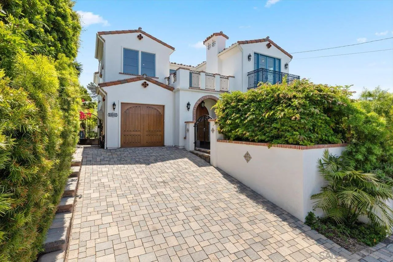 1015 Gardena Road Encinitas, CA 92024 - Photo 1 of 45 a front view of a house with a yard and garage