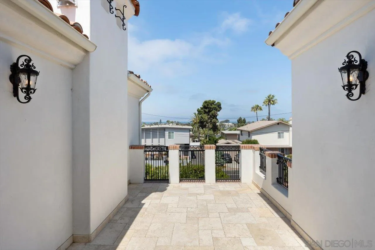 1015 Gardena Road Encinitas, CA 92024 - Photo 22 of 45 a kitchen with refrigerator and cabinets