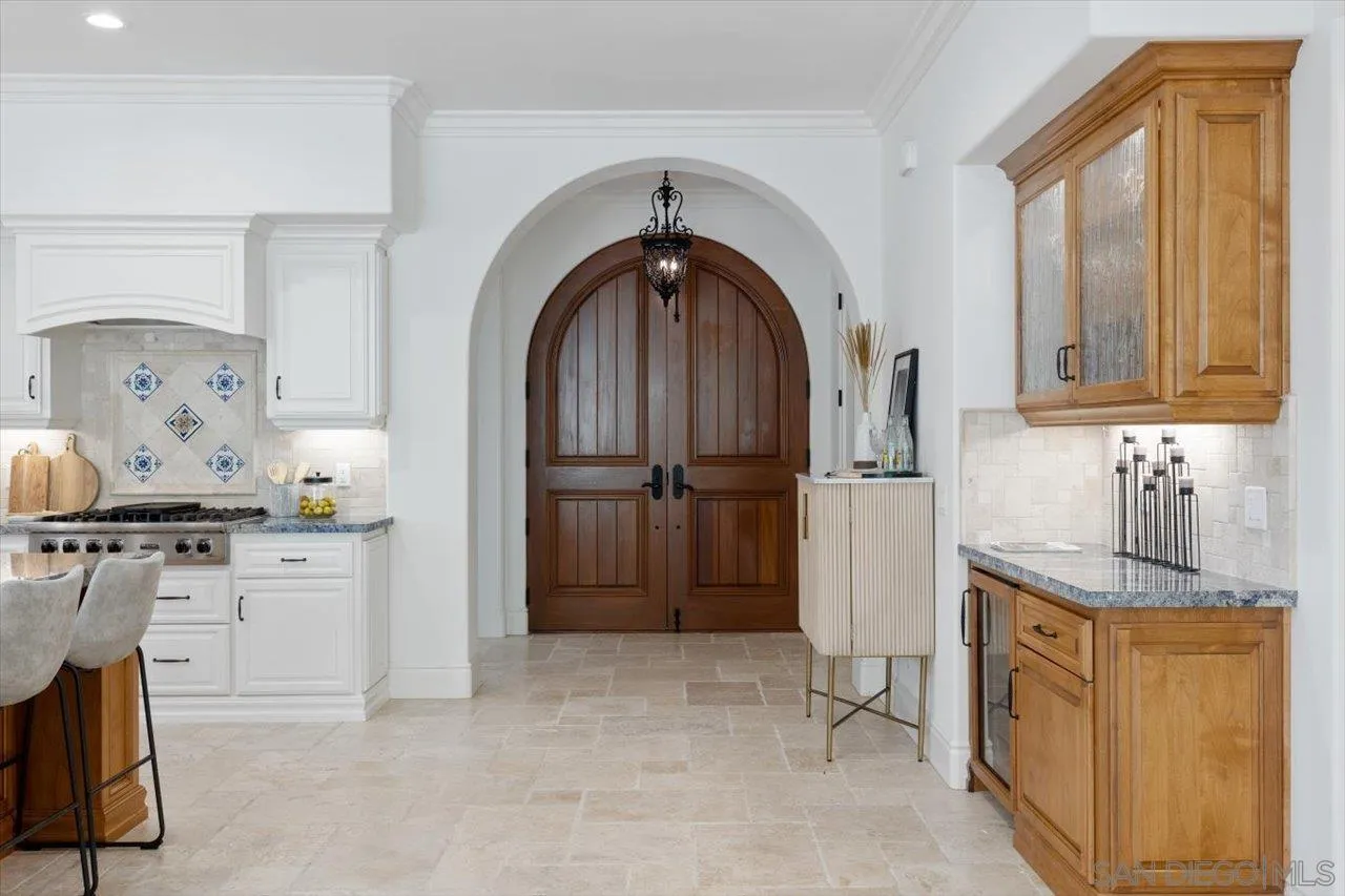 1015 Gardena Road Encinitas, CA 92024 - Photo 7 of 45 a kitchen with stainless steel appliances granite countertop a stove a refrigerator and a cabinets
