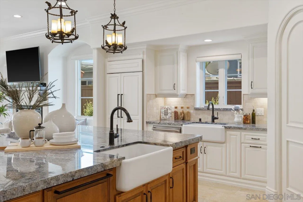1015 Gardena Road Encinitas, CA 92024 - Photo 10 of 45 a kitchen with granite countertop a sink a counter top space cabinets and stainless steel appliances