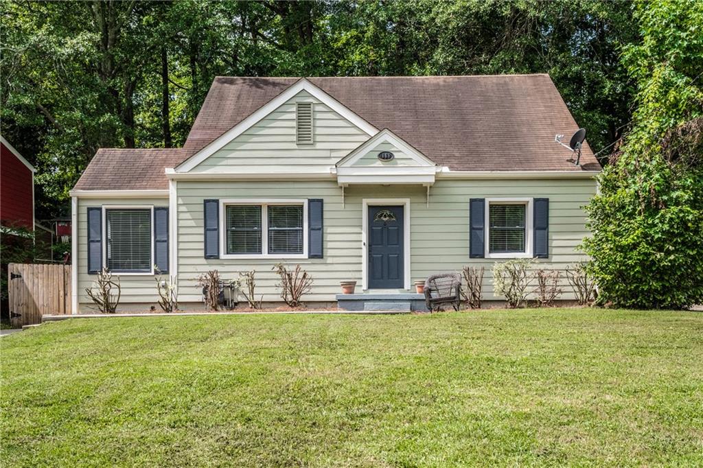 168 Rocky Ford Road Northeast Atlanta, GA 30317 - Photo 1 of 1 a front view of a house with yard and seating space
