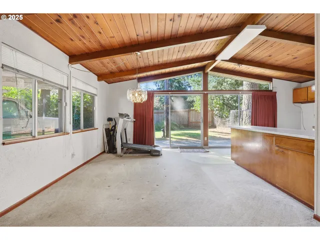 a view of an empty room with a balcony