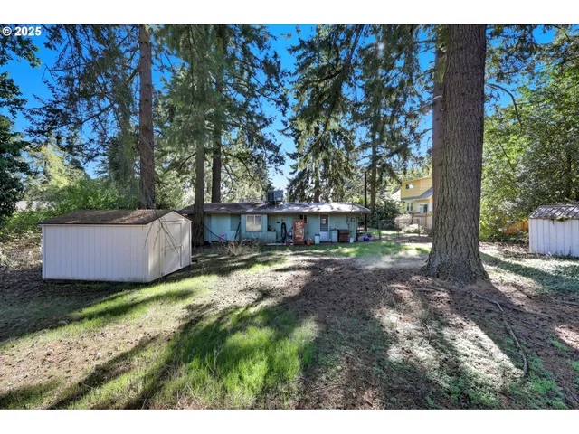 a view of house with outdoor seating area