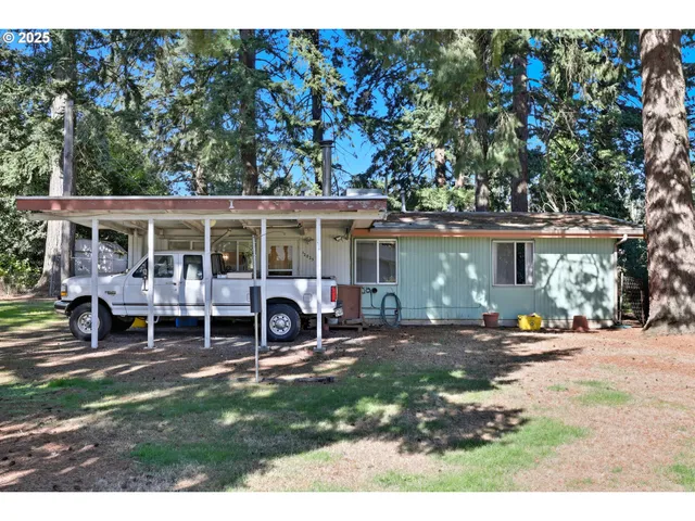 a view of a house with a yard patio and a patio