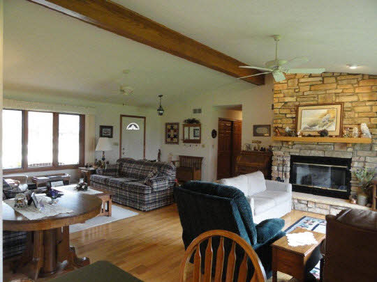 5505 Freeport Road Rockton, IL 61072 - Photo 2 of 11 a living room with furniture fireplace and window
