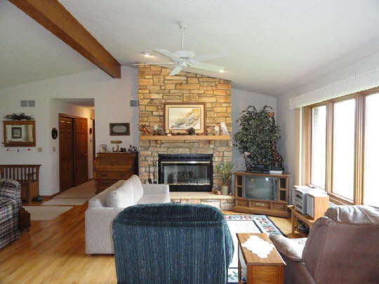 5505 Freeport Road Rockton, IL 61072 - Photo 3 of 11 a living room with furniture large window and fireplace