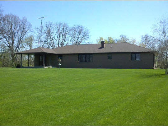 5505 Freeport Road Rockton, IL 61072 - Photo 8 of 11 a front view of a house with a garden