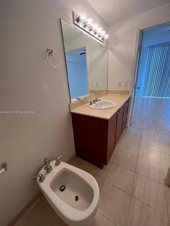 a bathroom with a toilet and tub