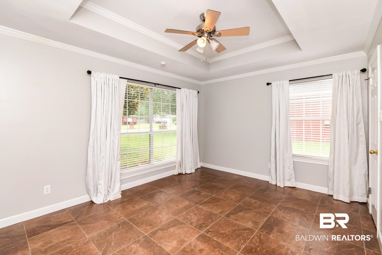 10691 Hunters Ridge Drive Mobile, AL 36695 - Photo 23 of 37 Room featuring tray ceiling detail and crown molding
