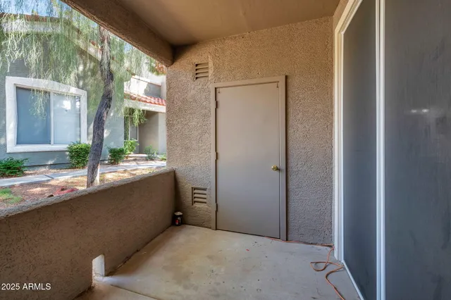 a picture of a bench in front of a door