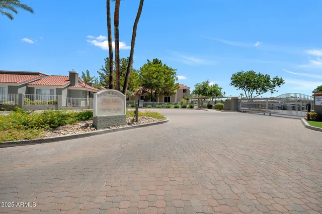 a view of a patio with couches table and chairs and potted plants