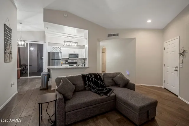 a living room with furniture and a large window