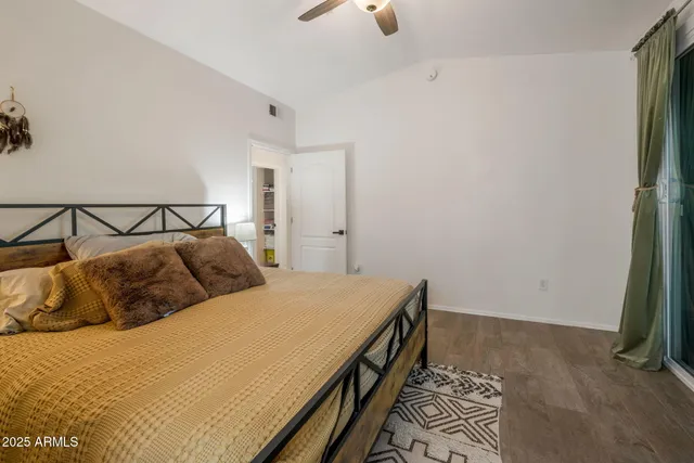 a bedroom with a bed and a walk in closet