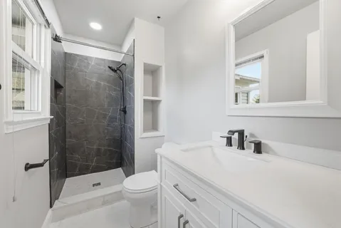 a view of entryway with wooden floor and stairs