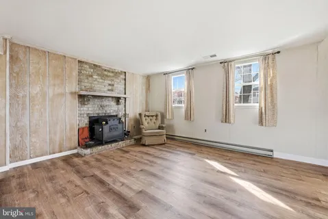 a front view of a house with a yard table and chairs