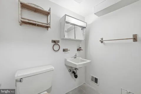 a picture of a wall with a white building