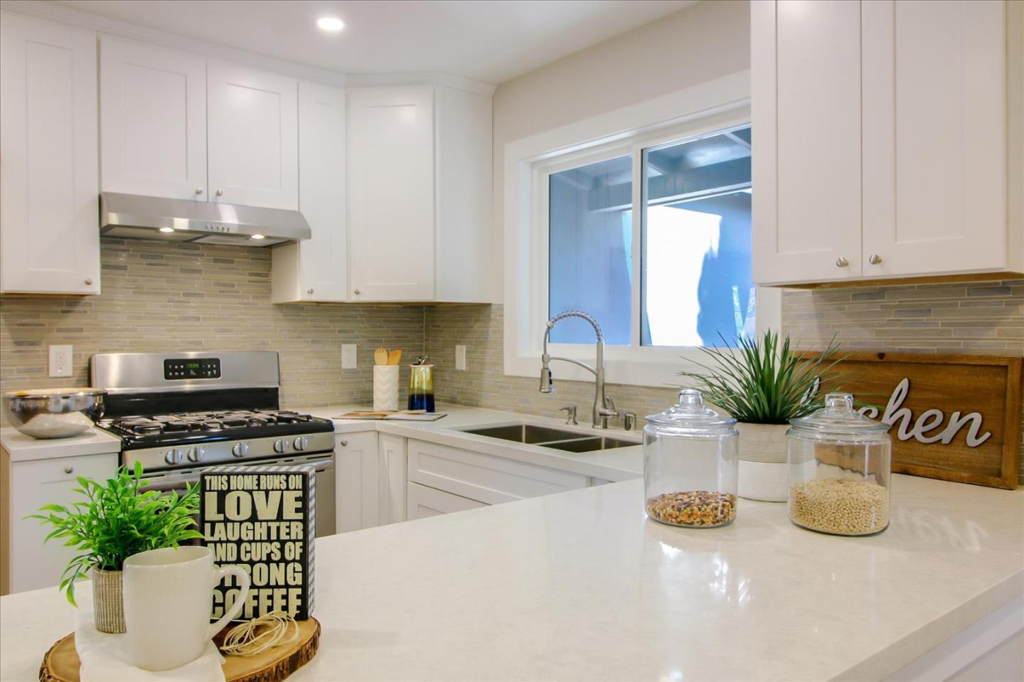 696 Coyote Road San Jose, CA 95111 - Photo 11 of 47 a kitchen with a sink a stove and cabinets