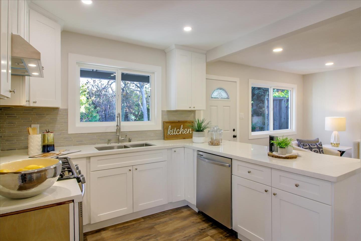 696 Coyote Road San Jose, CA 95111 - Photo 12 of 47 a kitchen with a sink stove and cabinets
