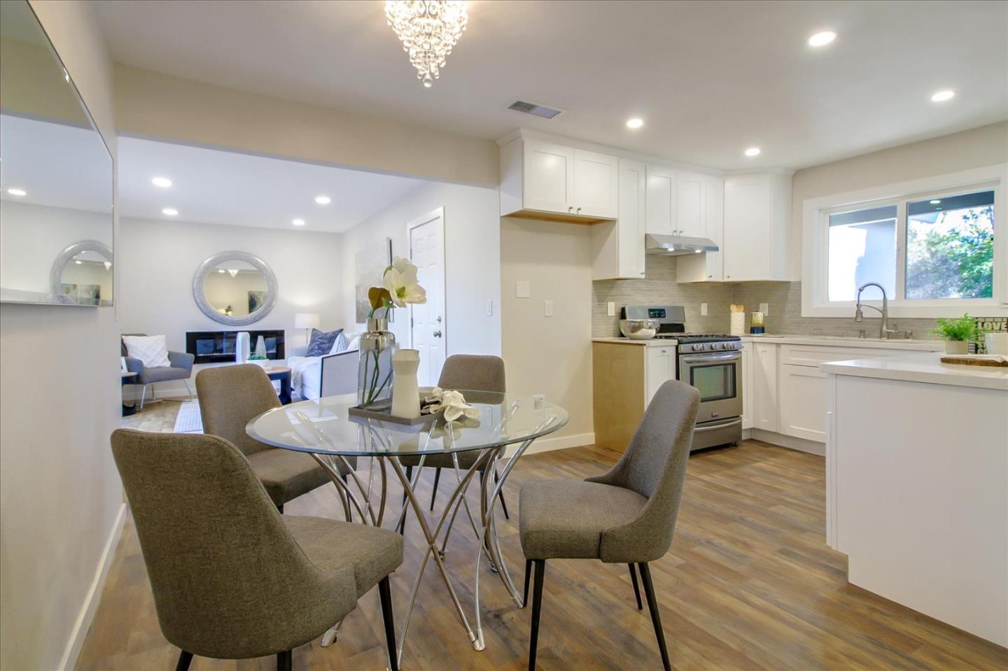 696 Coyote Road San Jose, CA 95111 - Photo 14 of 47 a view of a dining room with furniture and wooden floor