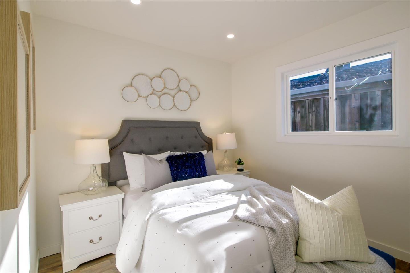 696 Coyote Road San Jose, CA 95111 - Photo 15 of 47 a bedroom with a bed and window