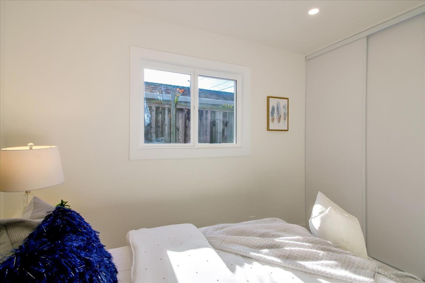 696 Coyote Road San Jose, CA 95111 - Photo 16 of 47 a bedroom with a bed and a window