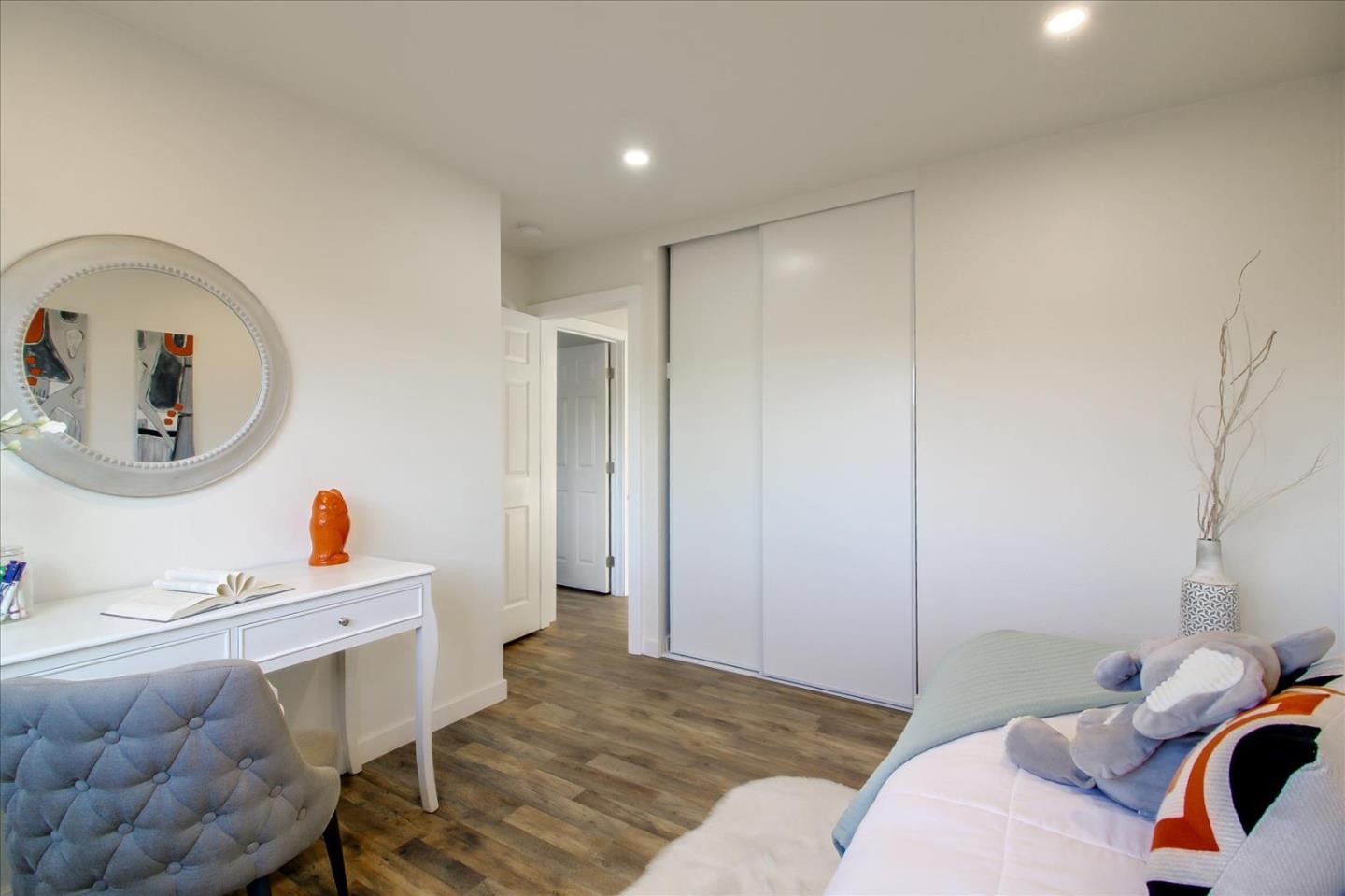 696 Coyote Road San Jose, CA 95111 - Photo 18 of 47 a bedroom with a bed and a dresser