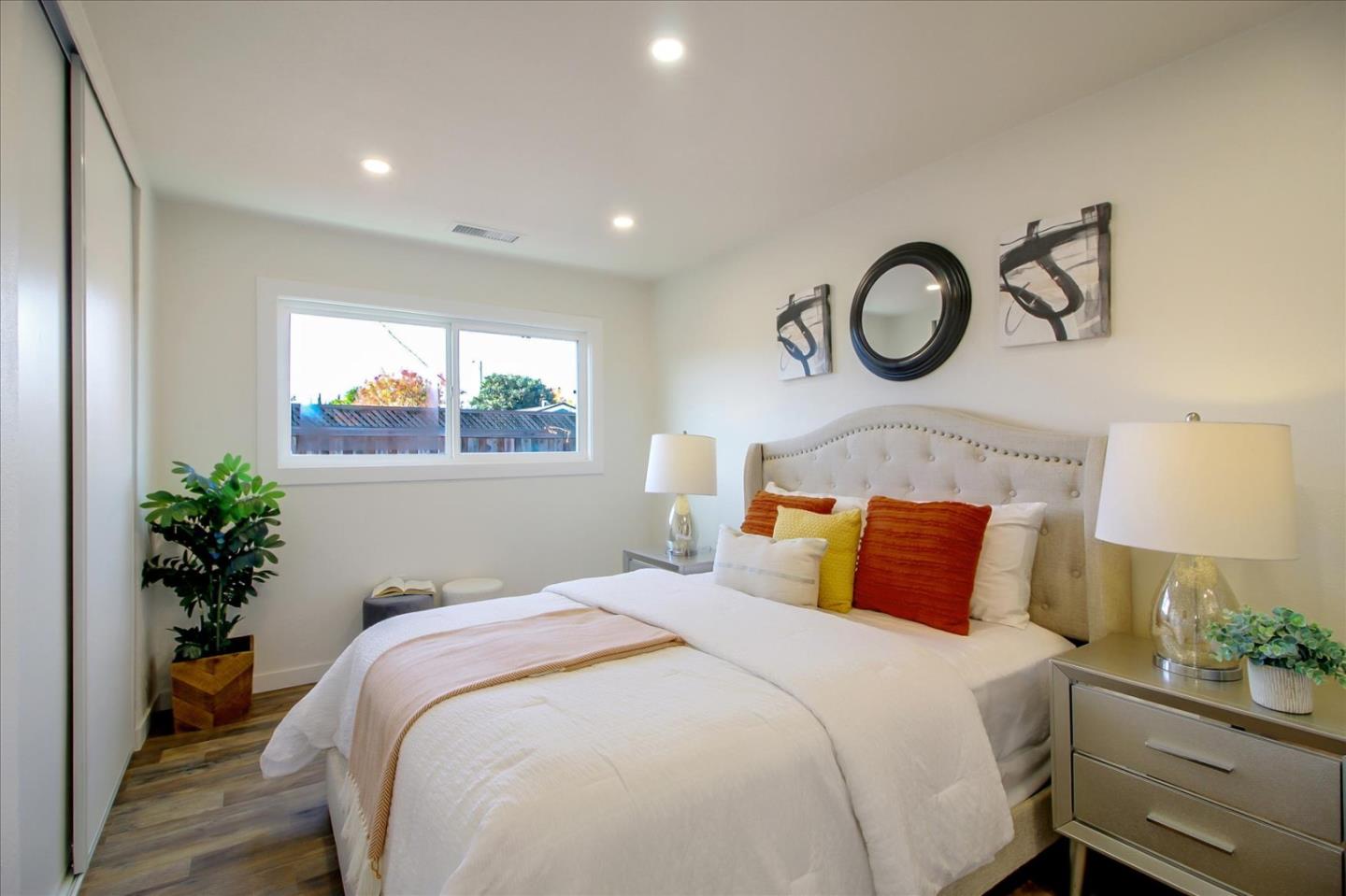 696 Coyote Road San Jose, CA 95111 - Photo 19 of 47 a bedroom with bed and a window