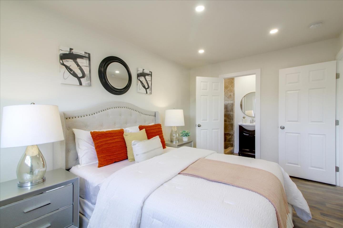 696 Coyote Road San Jose, CA 95111 - Photo 20 of 47 a bedroom with bed and a lamp