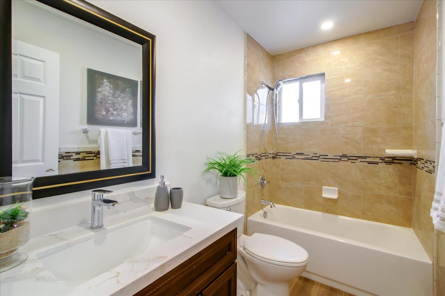 696 Coyote Road San Jose, CA 95111 - Photo 21 of 47 a bathroom with a sink a toilet and a bathtub
