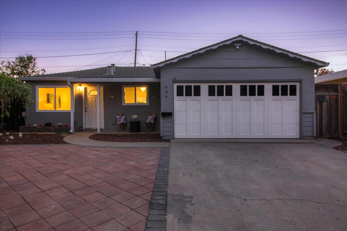 696 Coyote Road San Jose, CA 95111 - Photo 26 of 47 a front view of a house with a yard and garage