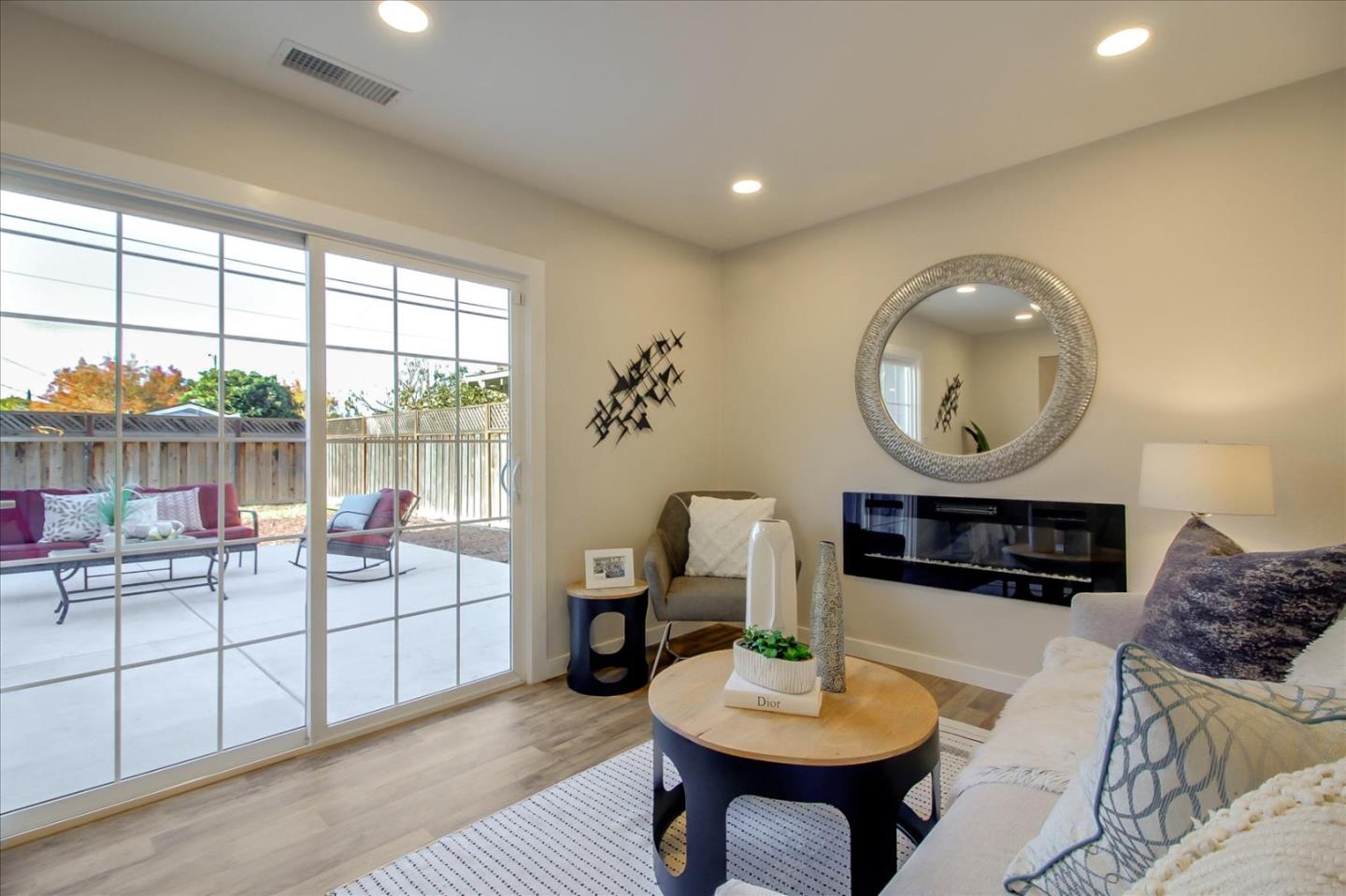 696 Coyote Road San Jose, CA 95111 - Photo 8 of 47 a living room with furniture a window and a table
