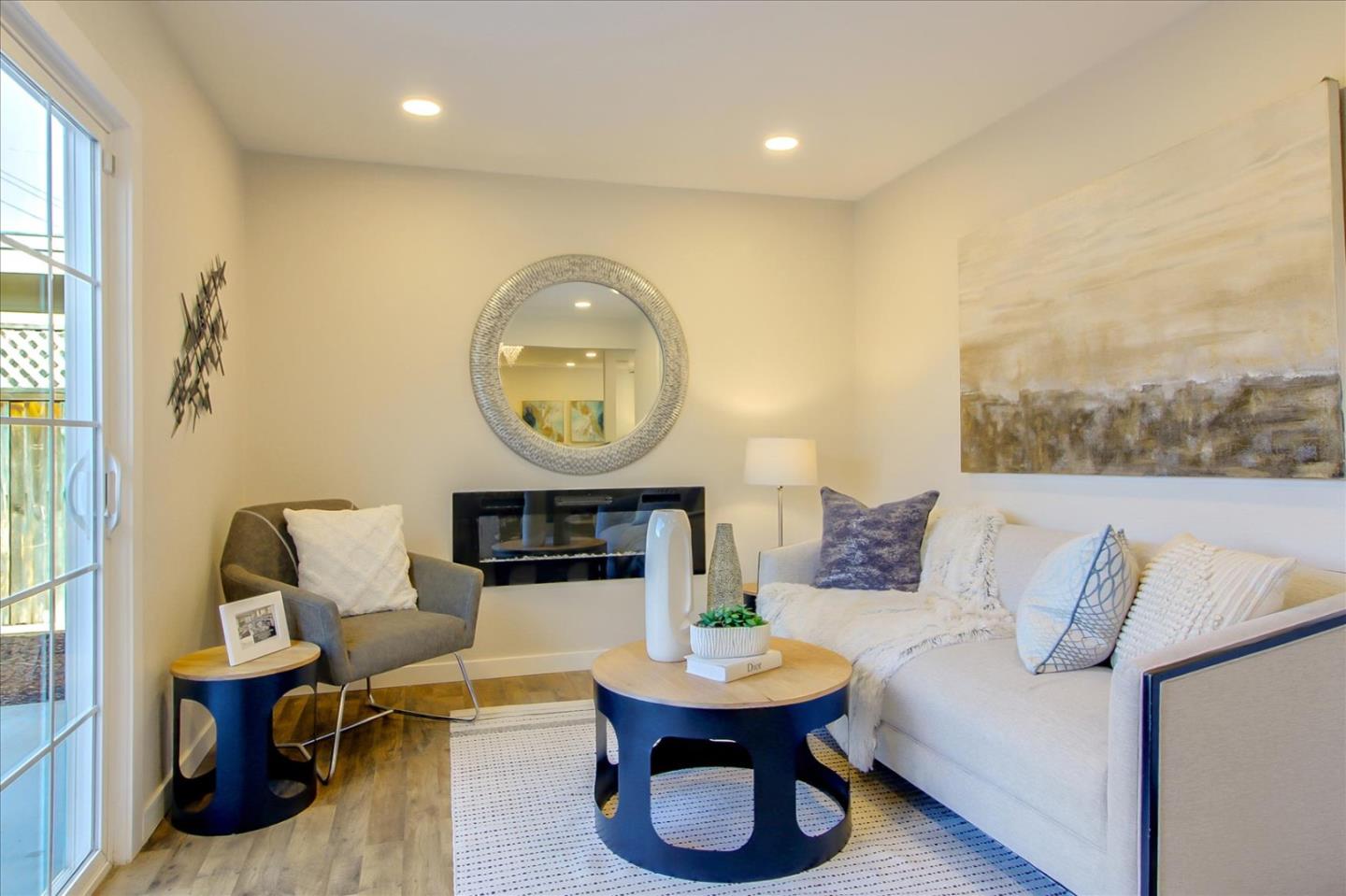 696 Coyote Road San Jose, CA 95111 - Photo 9 of 47 a living room with furniture and a painting on the wall