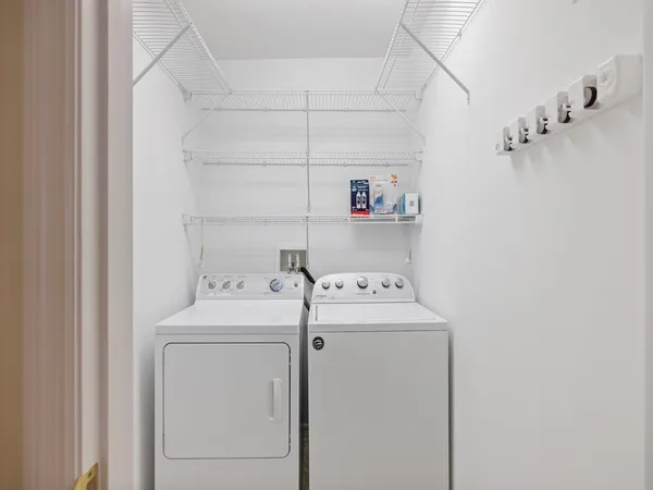 a utility room with dryer and washer