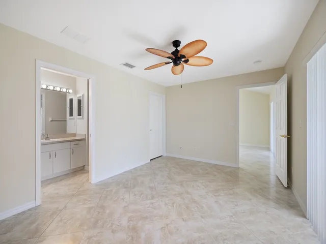 a view of a chandelier fan and closet in a room