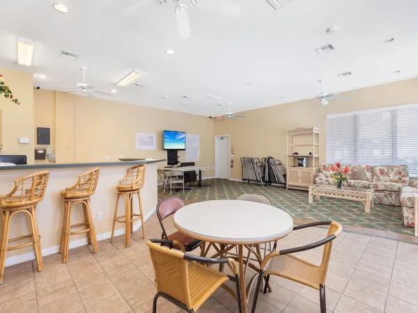 a kitchen with a table and chairs in it