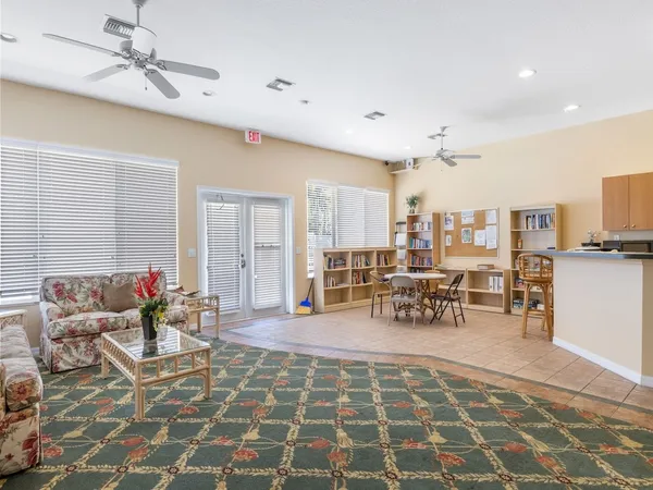 a lobby with furniture and view of living room