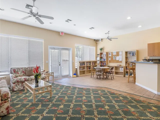 a lobby with furniture and view of living room