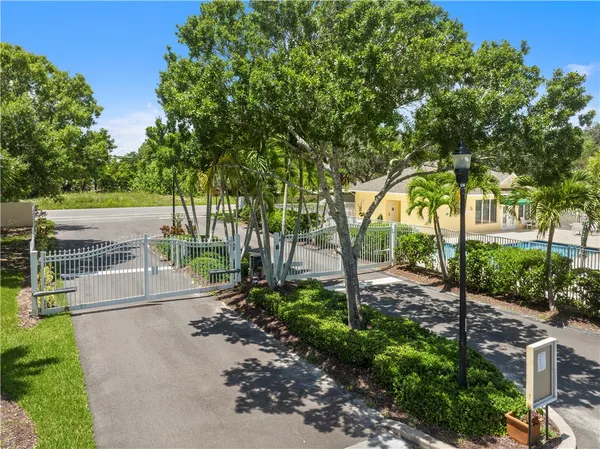a view of a park with large trees