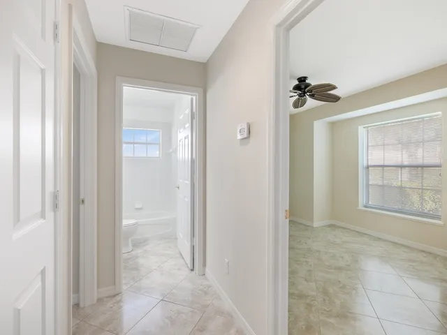 a view of a bathroom with a glass door shower