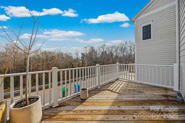 a view of a balcony with wooden floor