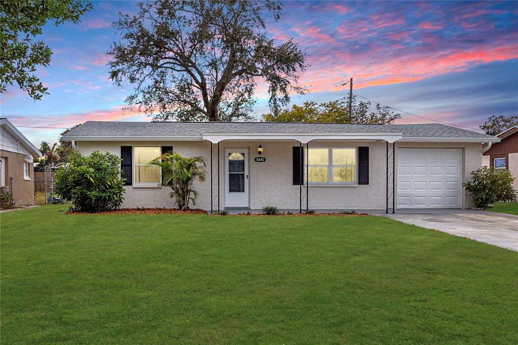 4840 Lake Ridge Lane Holiday, FL 34690 - Photo 1 of 1 Single Family Home -4840 Lake Ridge Ln, Holiday, FL 34690 -Grass and Sky Edits