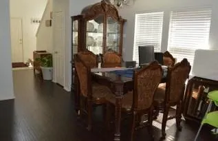 a view of a dining room with furniture window and outside view