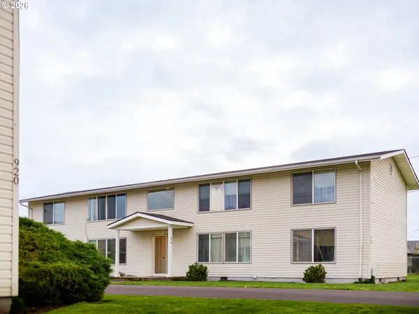 a front view of building with yard