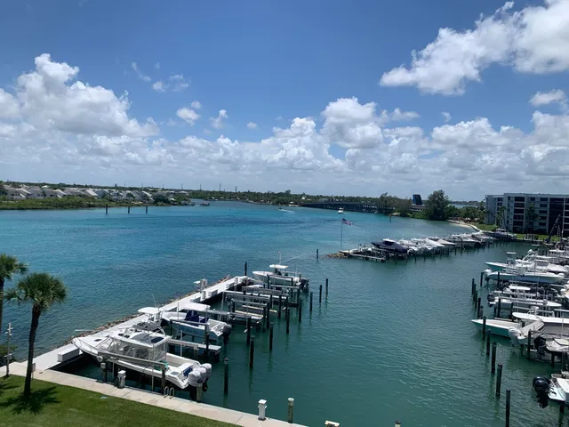 a view of a lake with houses in back