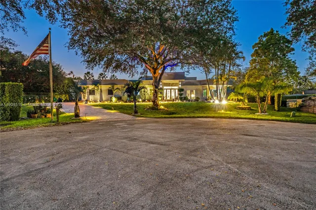 a view of road with large trees