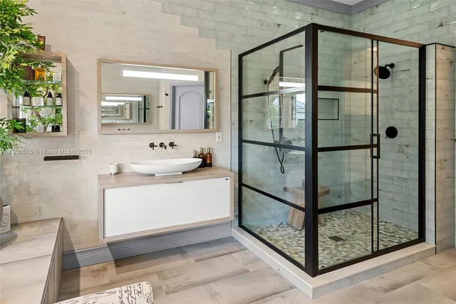 a bathroom with a shower and mirror