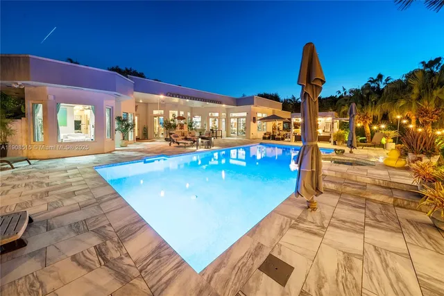 a view of a swimming pool with a patio