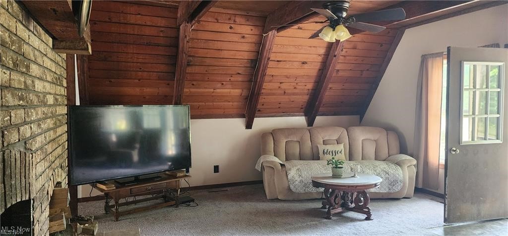 6699 Howard Road Williamsfield, OH 44093 - Photo 21 of 31 Unfurnished room with ceiling fan, carpet flooring, vaulted ceiling with beams, and wooden ceiling